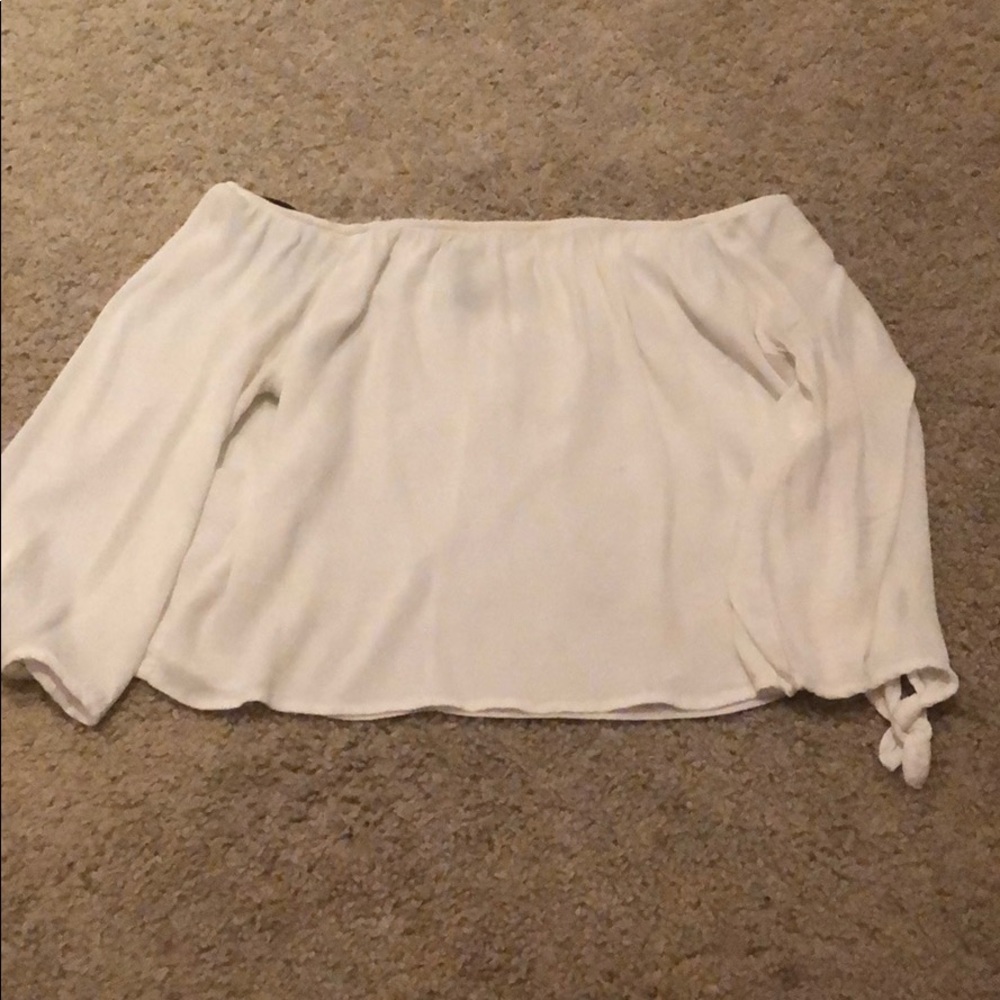 white cropped off the shoulder shirt
